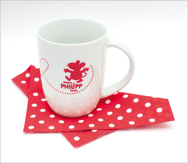 Die Abbildung zeigt die weiße Tasse mit aufgedrucktem rotem PHILIPP-Logo
